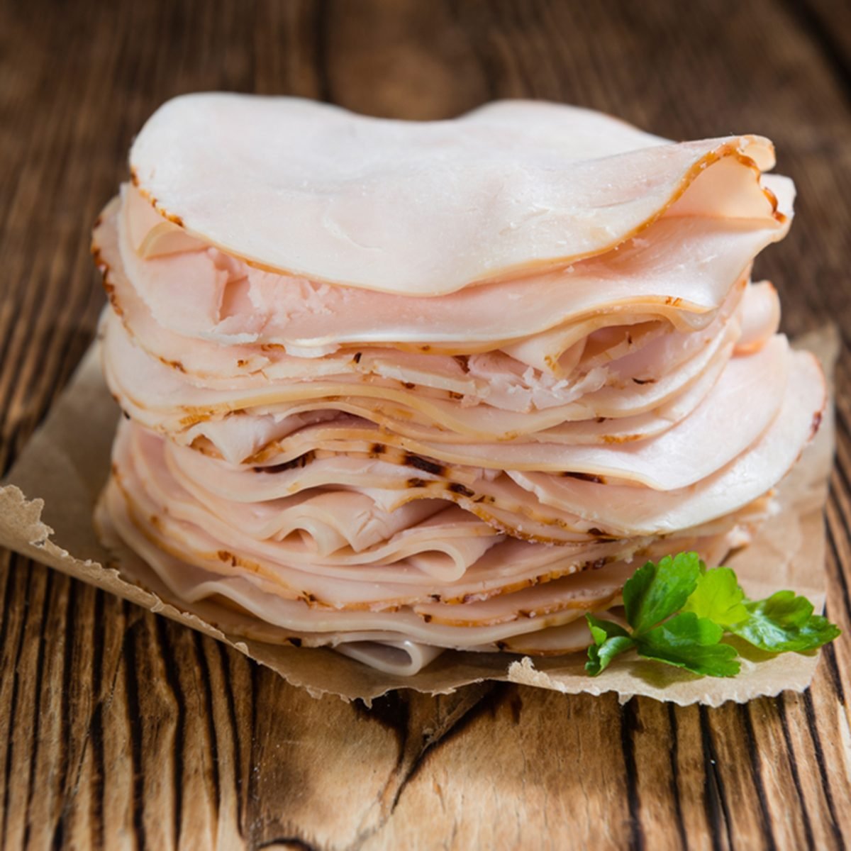 Sliced Chicken Breast fillet (selective focus) on wooden background; Shutterstock ID 381413266; Job (TFH, TOH, RD, BNB, CWM, CM): TOH