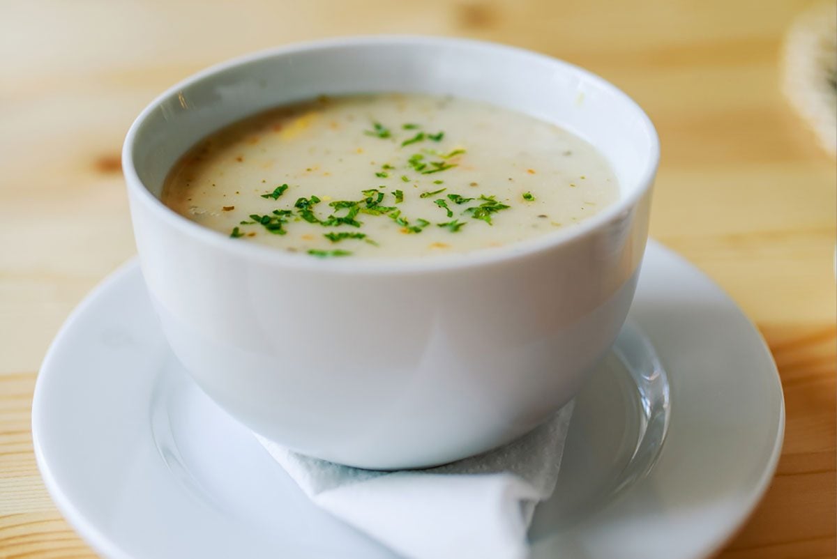 Garlic soup on a wooden table in a restaurant.