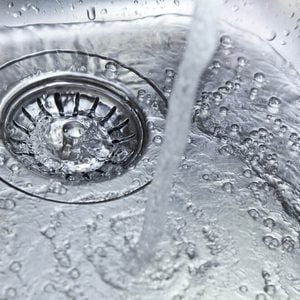 water flowing down the kitchen sink