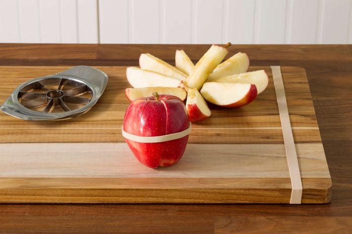 rubberbands, apples, cutting board, kitchen,