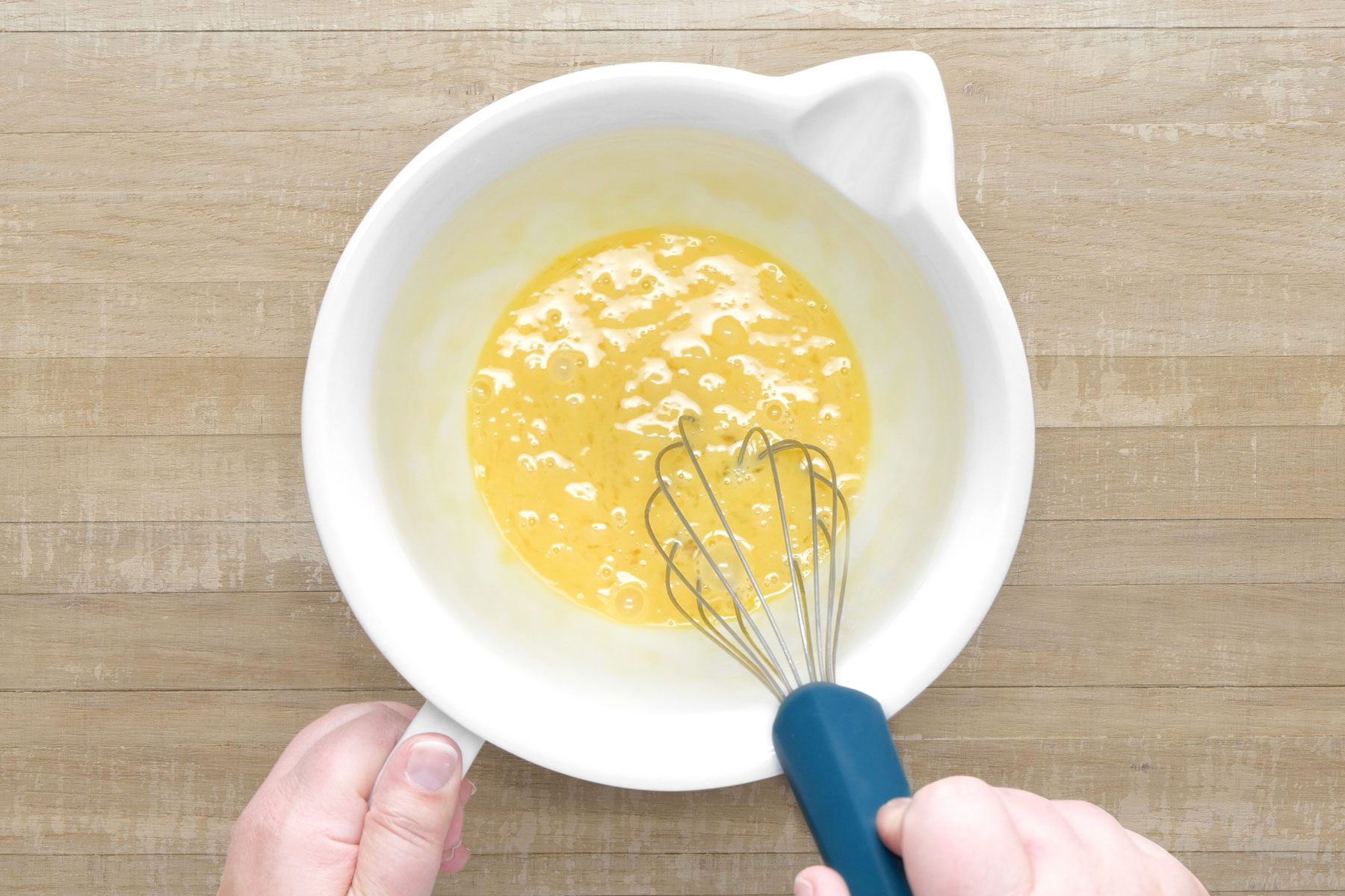 Whisking the eggs in a large bowl