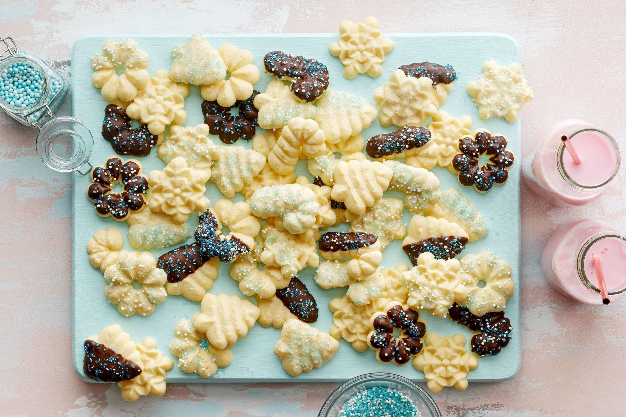 Buttery Spritz Cookies on Light Cyan Cutting Board