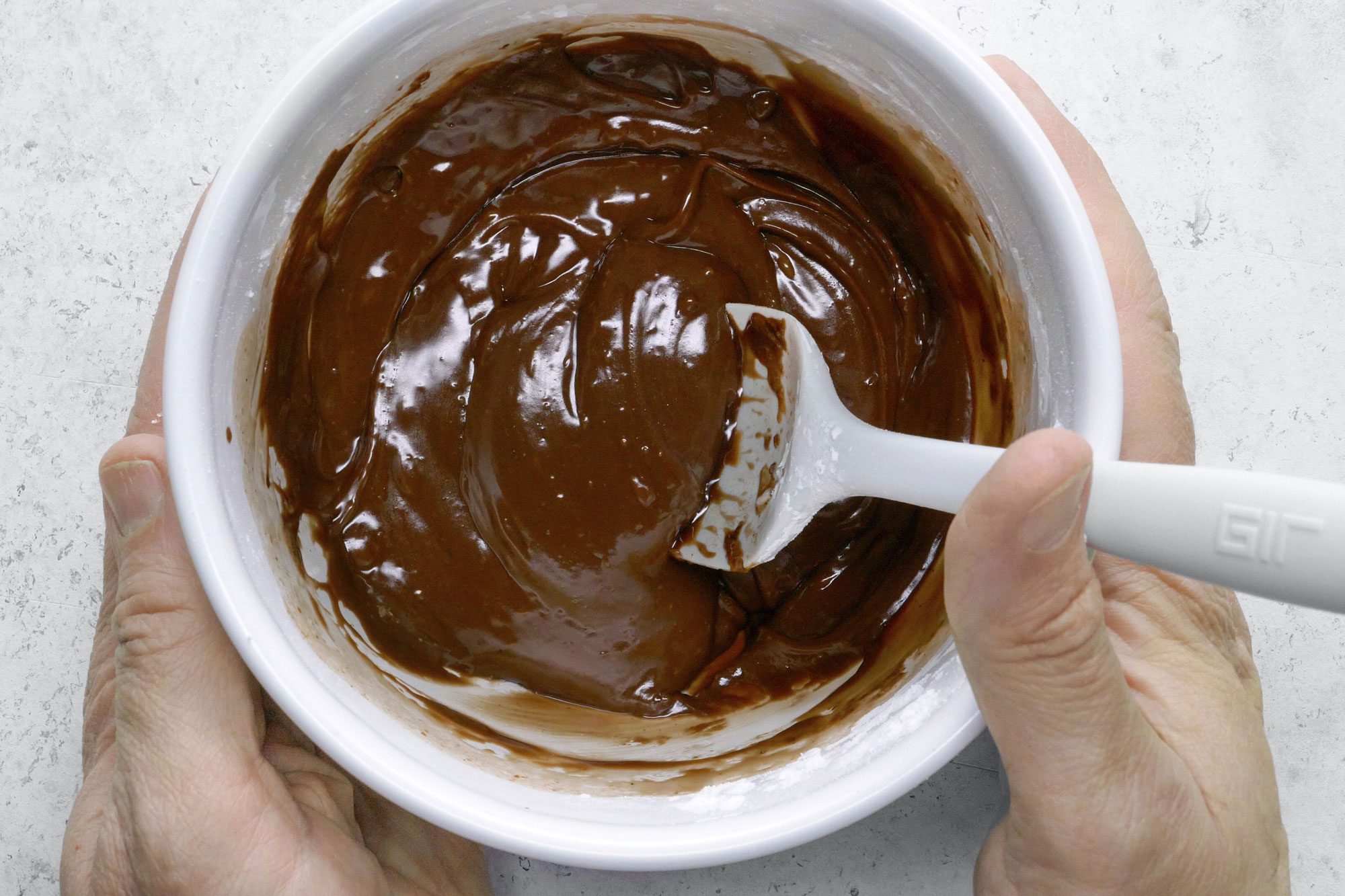 Chocolate Eclairs making the frosting
