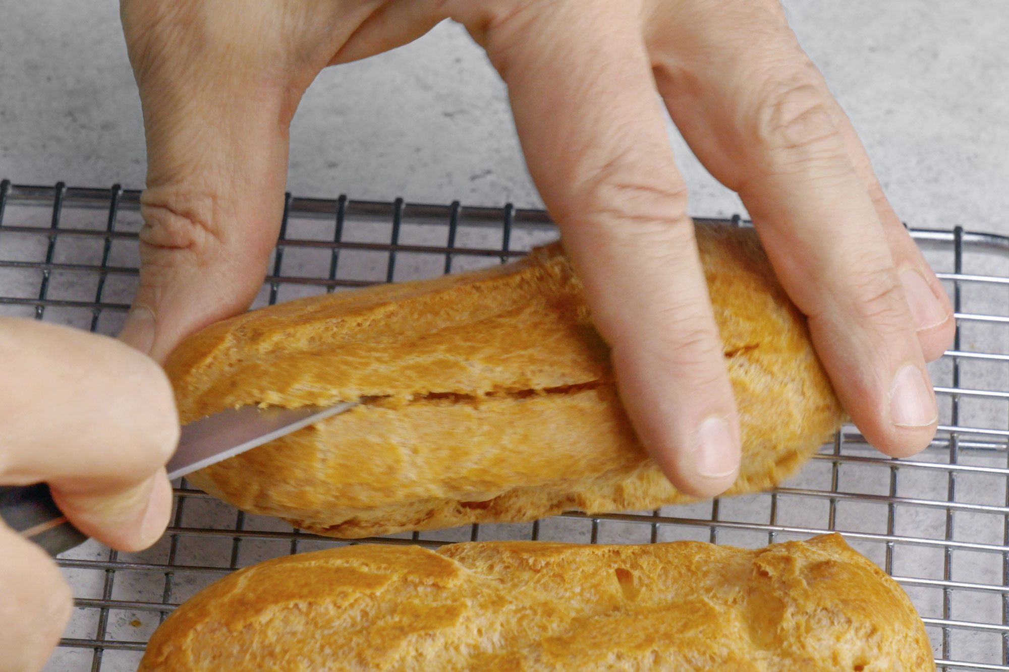 Chocolate Eclairs split opening the shells