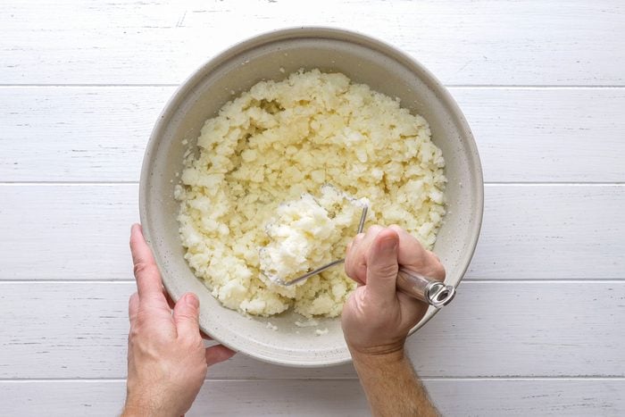 Boiled potatoes mashed in a bowl