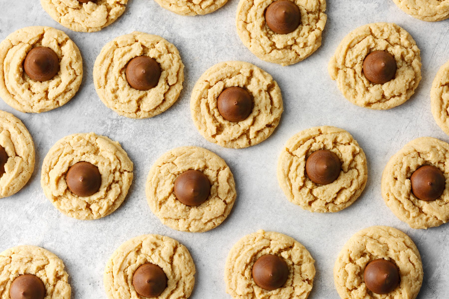Peanut Butter Blossom cookies on a white marble