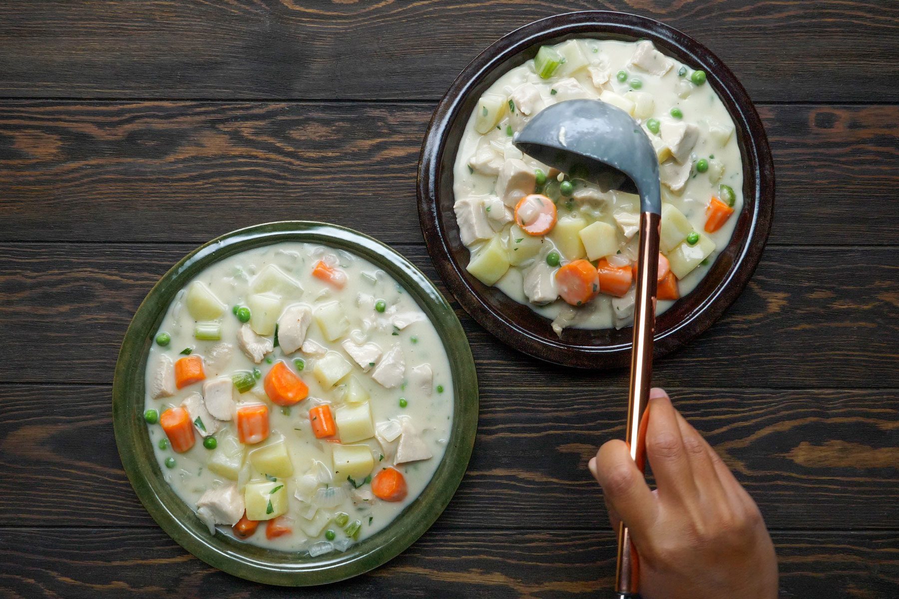 Turkey mixture being evenly spooned into different plates