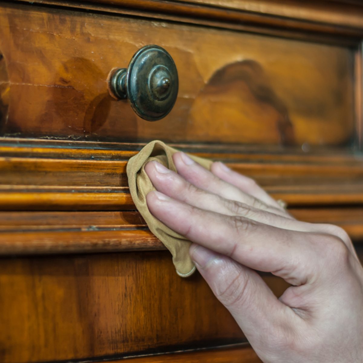Furniture restoration. Hand cleaning a wood furniture with a cloth; Shutterstock ID 766459951; Job (TFH, TOH, RD, BNB, CWM, CM): TOH