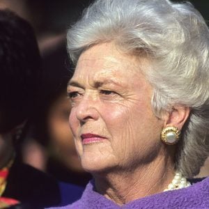 First Lady Barbara Bush holds her hand over her heart as the American Athem is played at the White House during official State visit ceremony on the South Lawn. Political figures, America