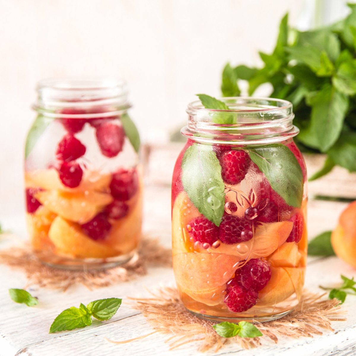 Cold Fruit Infused Detox Water with apricots raspberries and mint