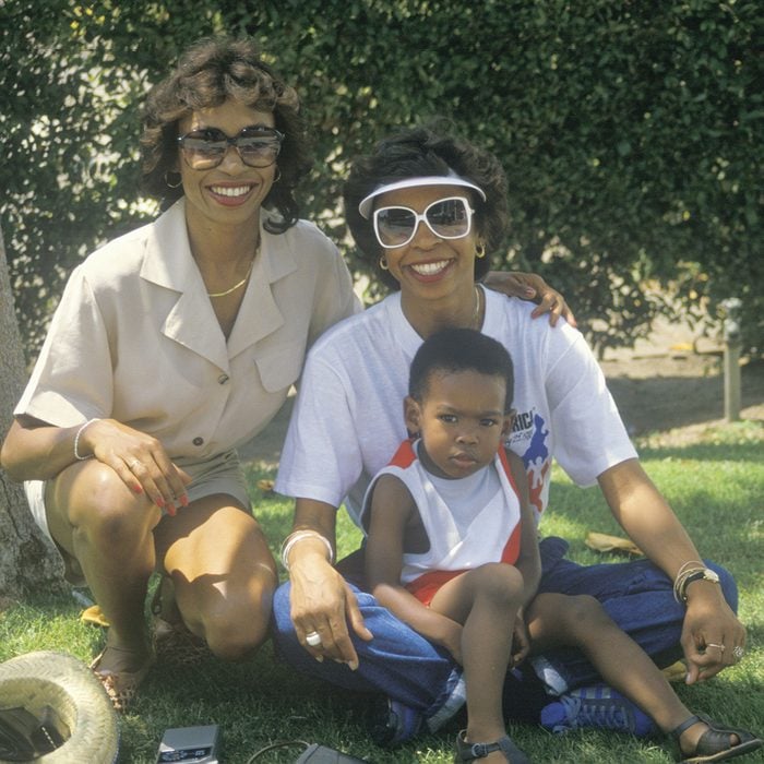 Mandatory Credit: Photo by Stock Connection/REX/Shutterstock (2395690a) African - American women and child sitting under a tree, Los Angeles, CA. VARIOUS