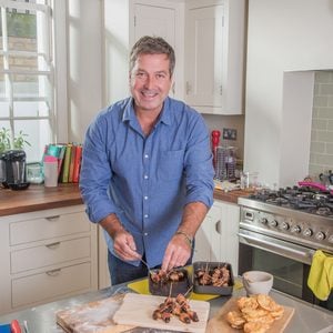 MUST CREDIT: AL&K/Rex Features Mandatory Credit: Photo by AL K/REX/Shutterstock (4231888c) John Torode Launch of the Tassimo Perfect Host panel, London, Britain - 05 Nov 2014 FULL COPY: http://www.rexfeatures.com/nanolink/pm15 Millie Mackintosh, John Torode and coffee expert Hazel Middleton launch the Tassimo Perfect Host panel. They have teamed up with the hot drinks machine brand to give the nation helpful hints and tips on how to host the perfect gathering this festive season.