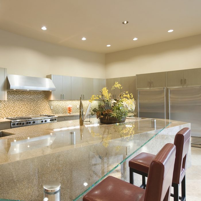 Glass topped breakfast table in modern kitchen