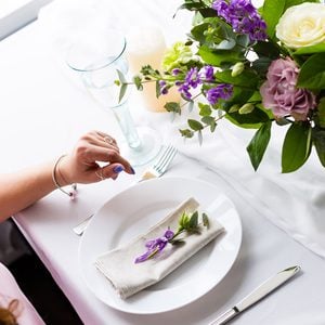 Romantic dinner setup with fresh flowers in a restaurant