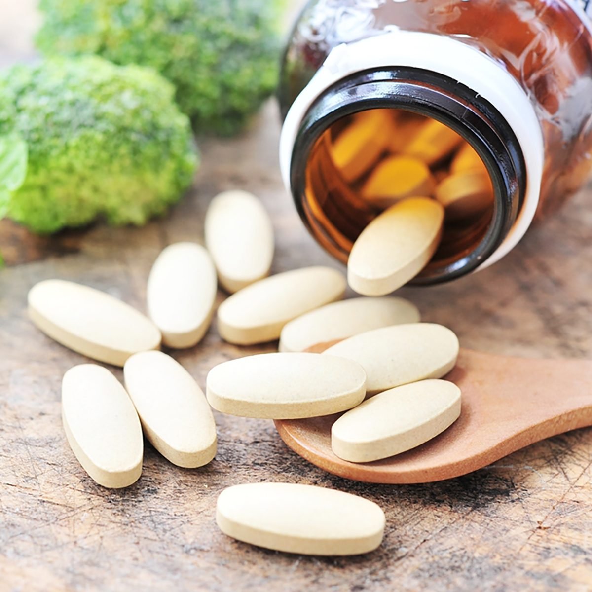Vitamin C on wooden table.