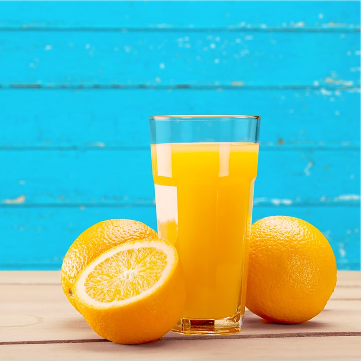 Orange Juice on blue background. 