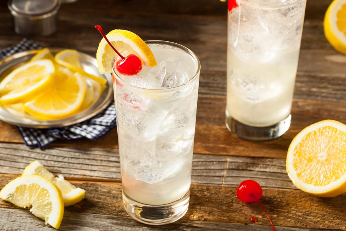 Refreshing Classic Tom Collins Cocktail with a Cherry and Lemon Slice