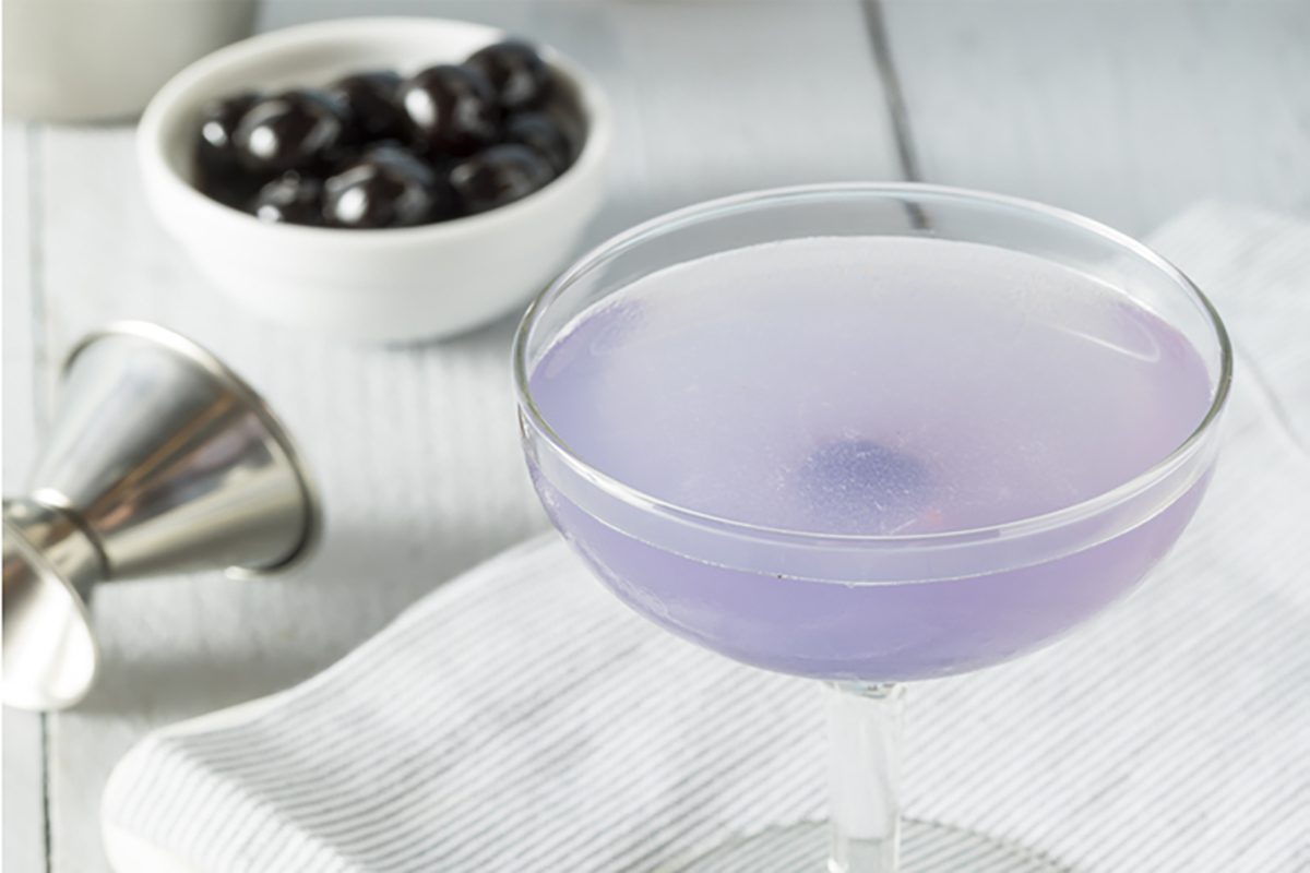 Sweet Violet Aviation Cocktail with a Cherry Garnish