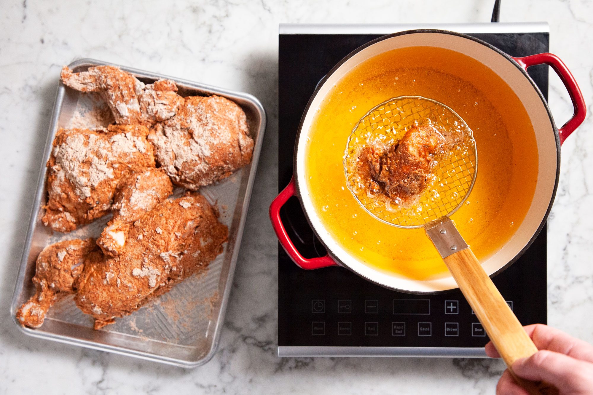 Deep Frying Chicken in Hot Boiling Oil in Pan
