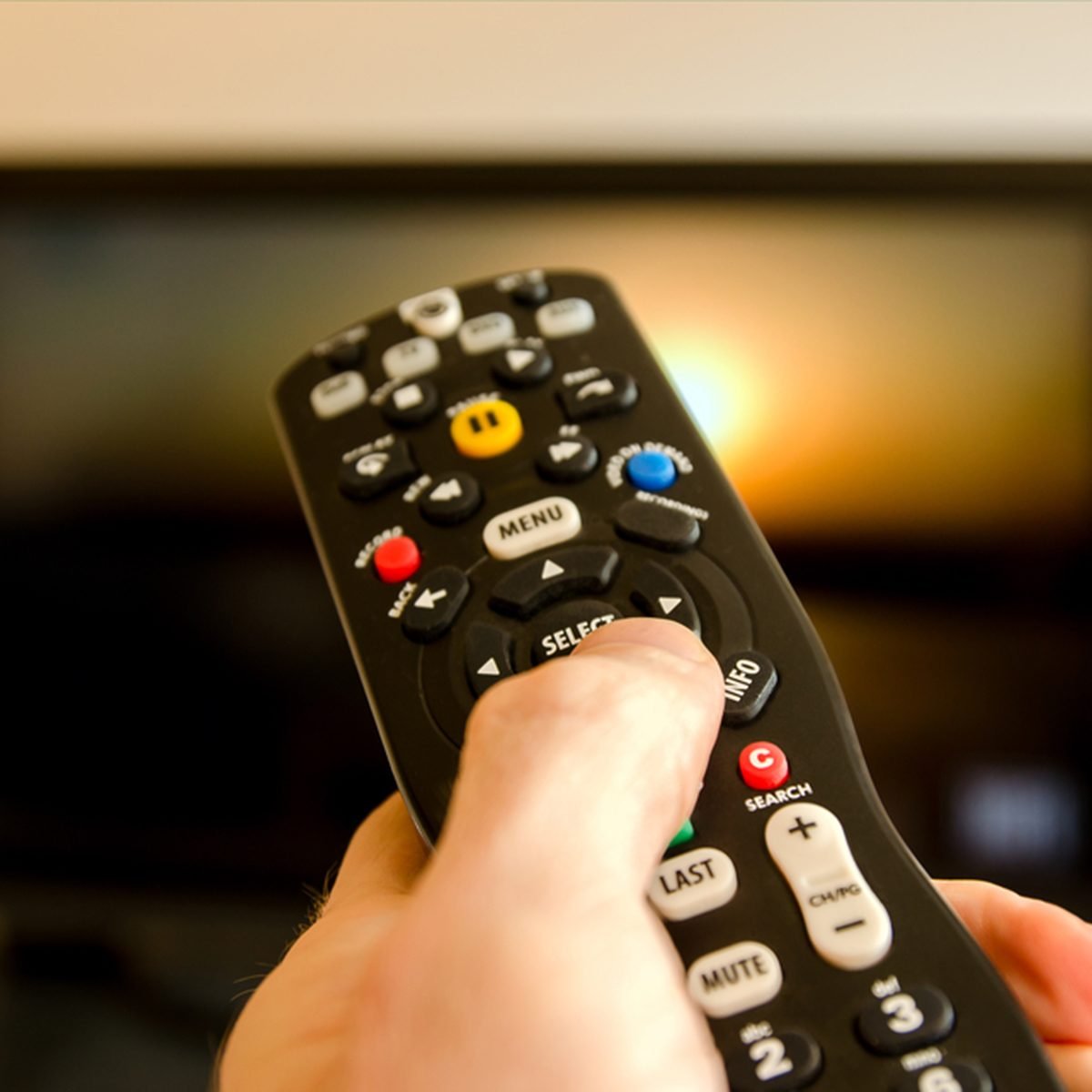 Watching tv and using remote control