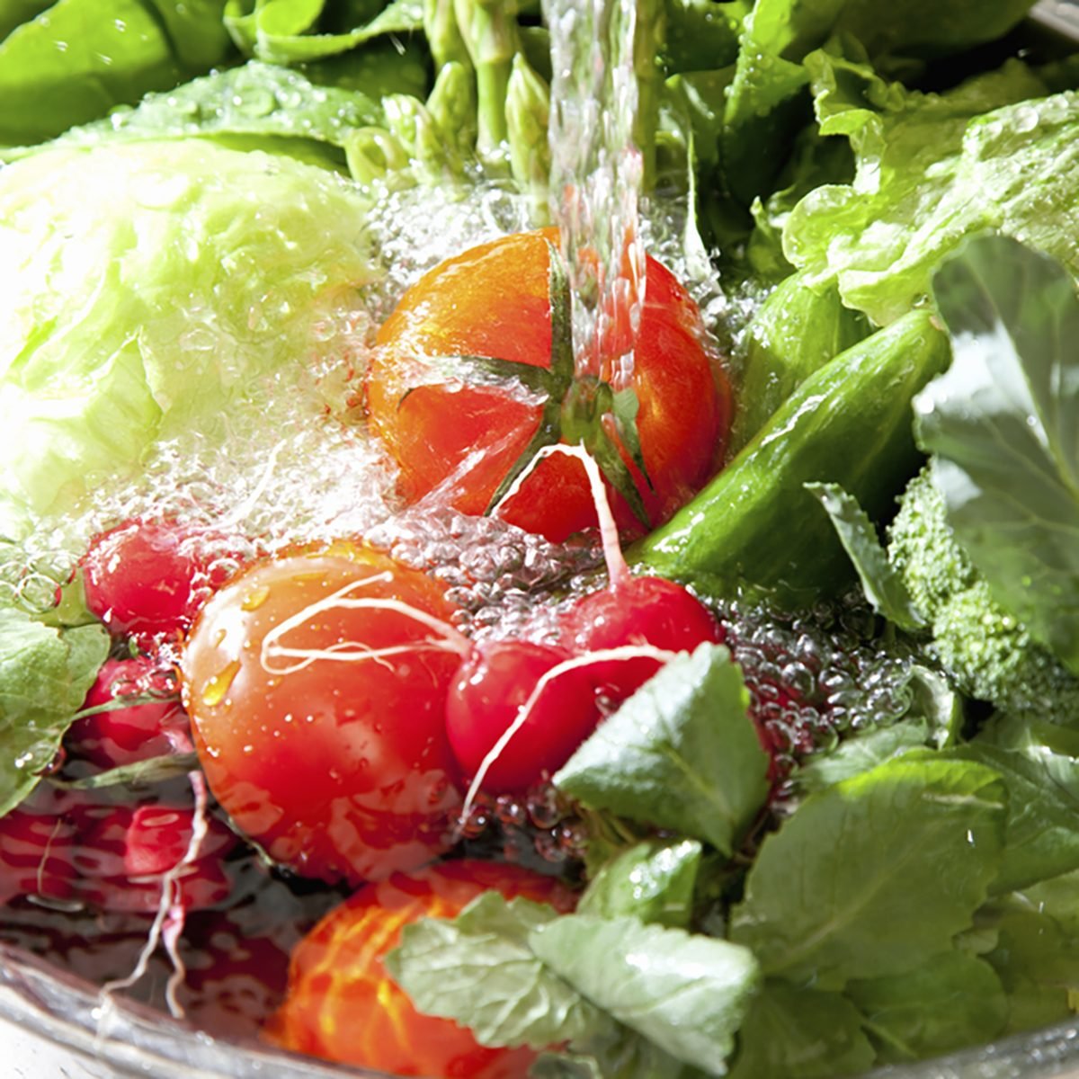 A variety of vegetables to wash the sink