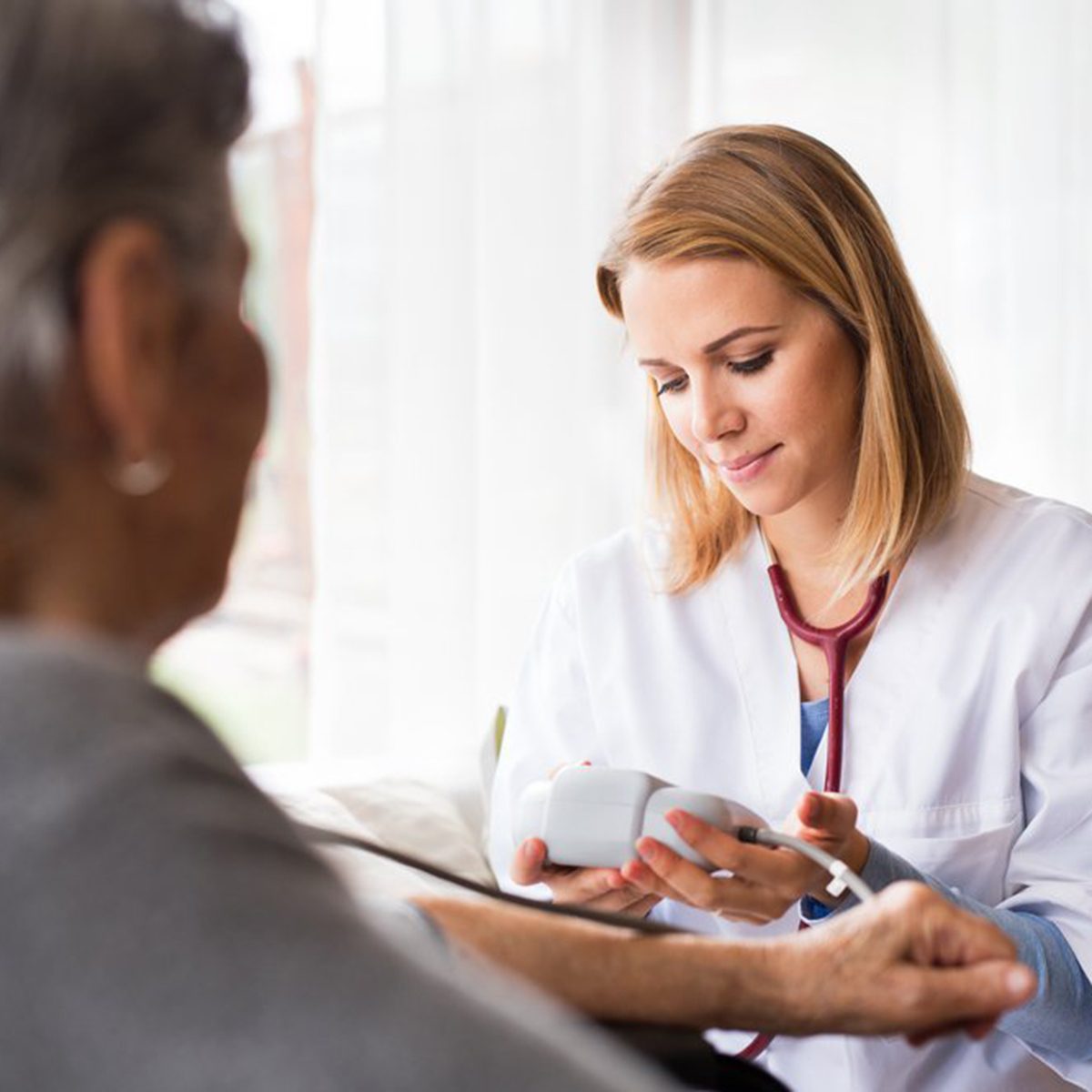 Doctor checking her patient