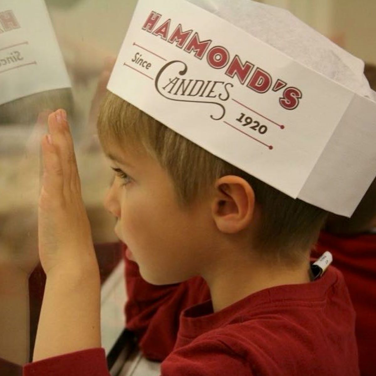Child watching candy being made