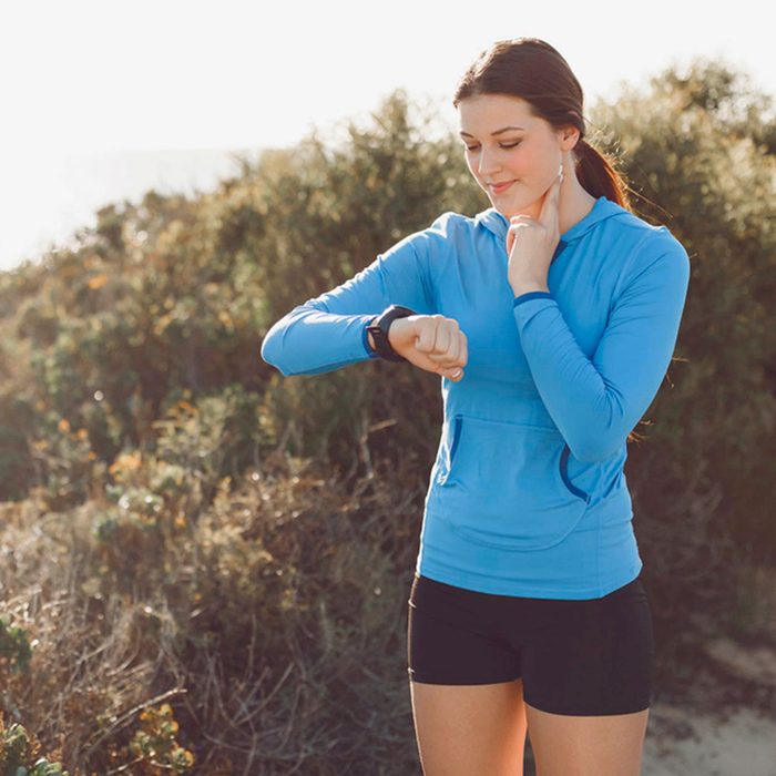 Woman checking her heart rate