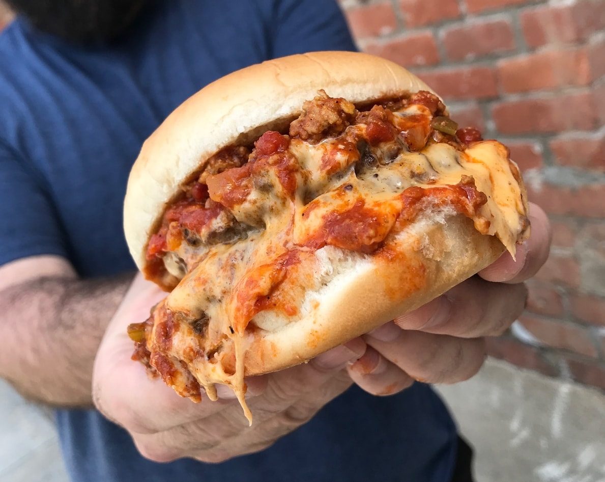 Hormel chili on a bun with cheese