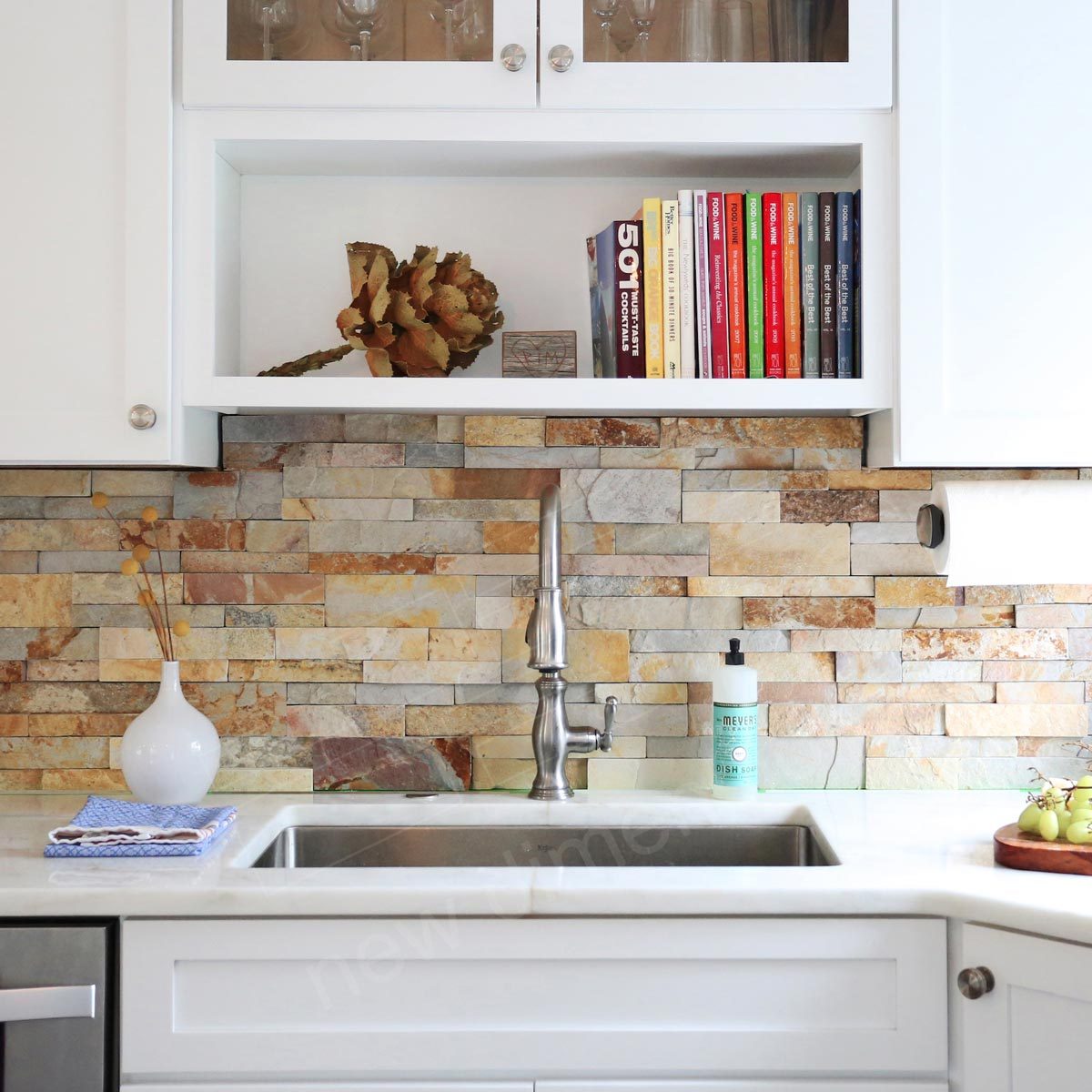 Kitchen with a stone backsplash