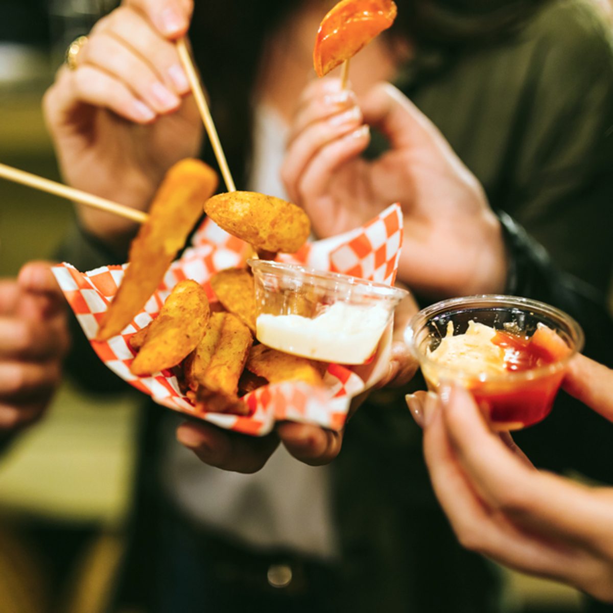 Portrait of group of friends visiting eat market in the street.
