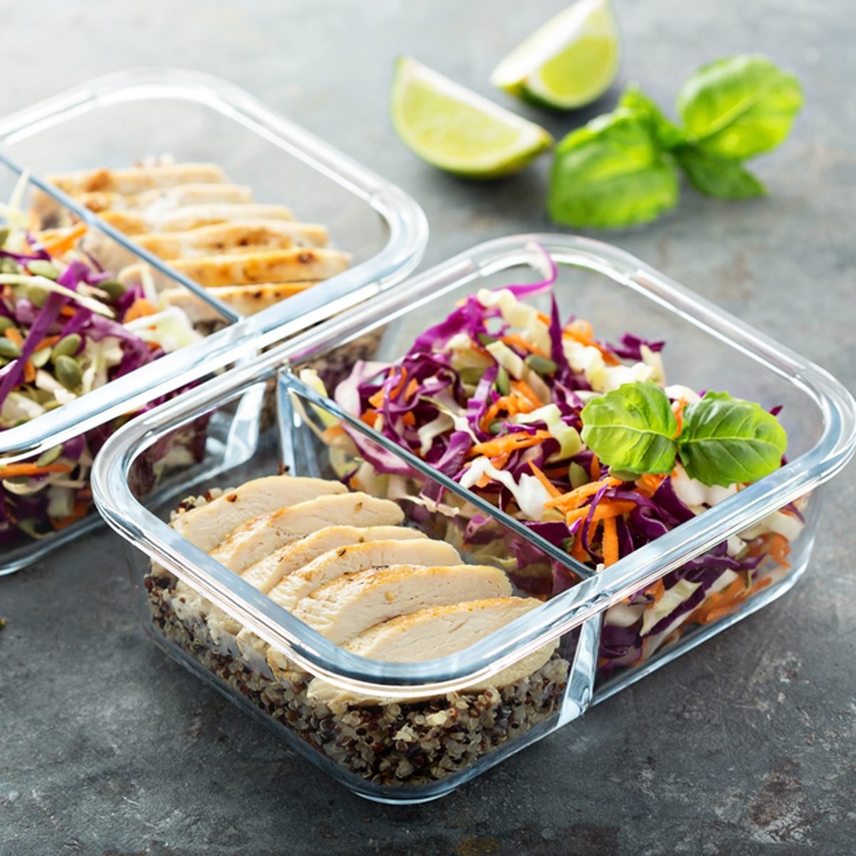 Healthy meal prep containers with quinoa, chicken and cole slaw