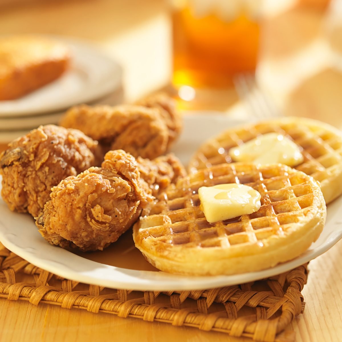 chicken and waffles with sweet tea in background