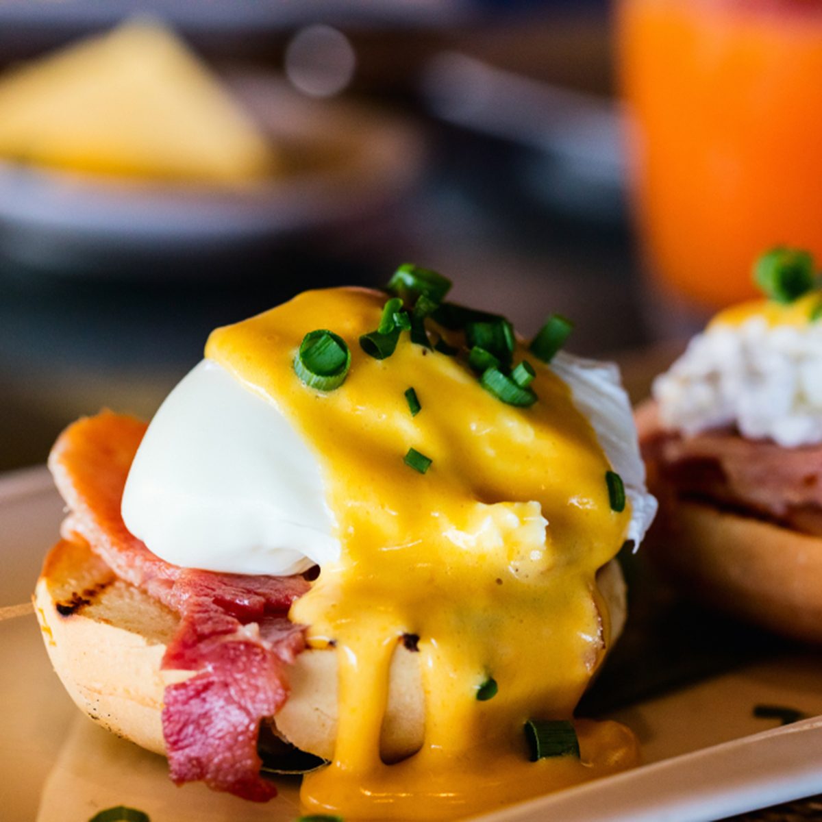 Delicious breakfast with eggs Benedict and juice