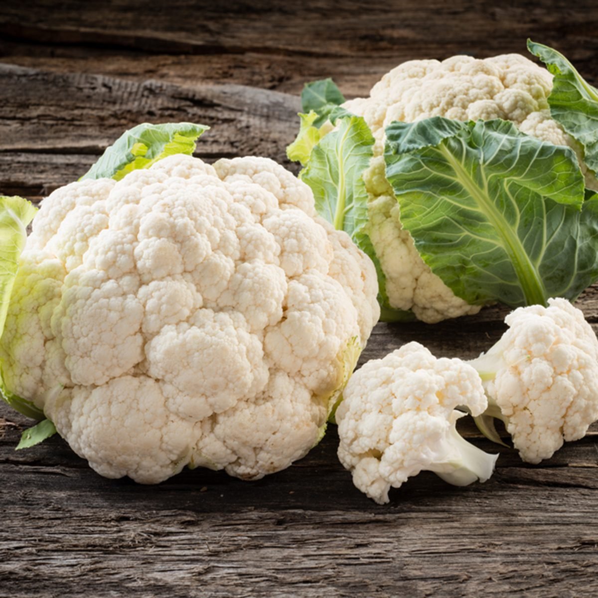 Organic cauliflower on wooden background