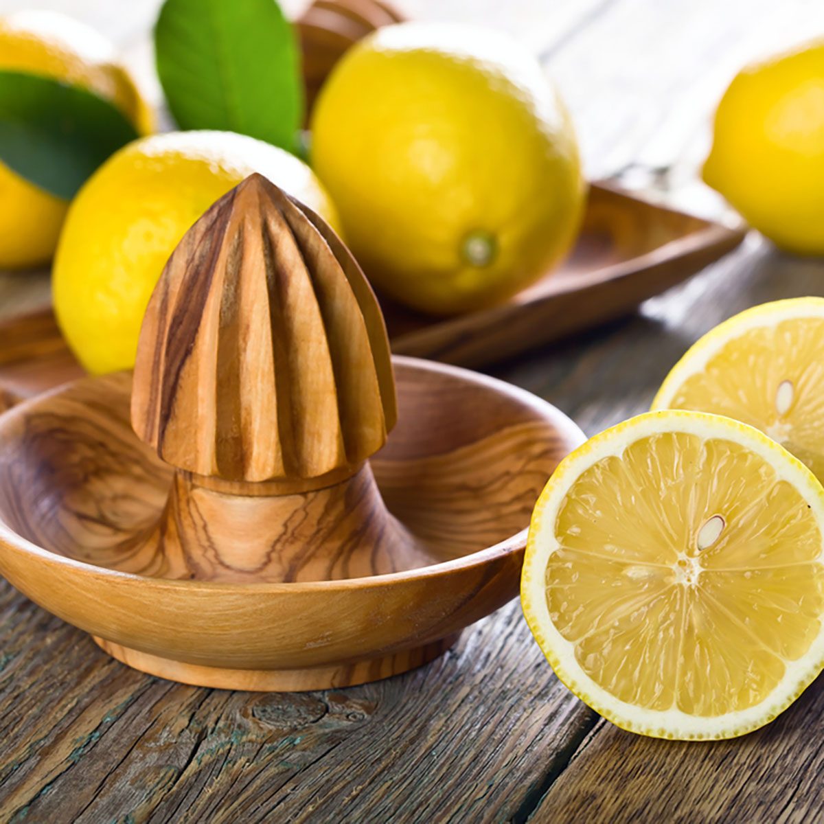 Ripe lemons and squeezer on a old wooden table .; Shutterstock ID 679854553; Job (TFH, TOH, RD, BNB, CWM, CM): Taste of Home