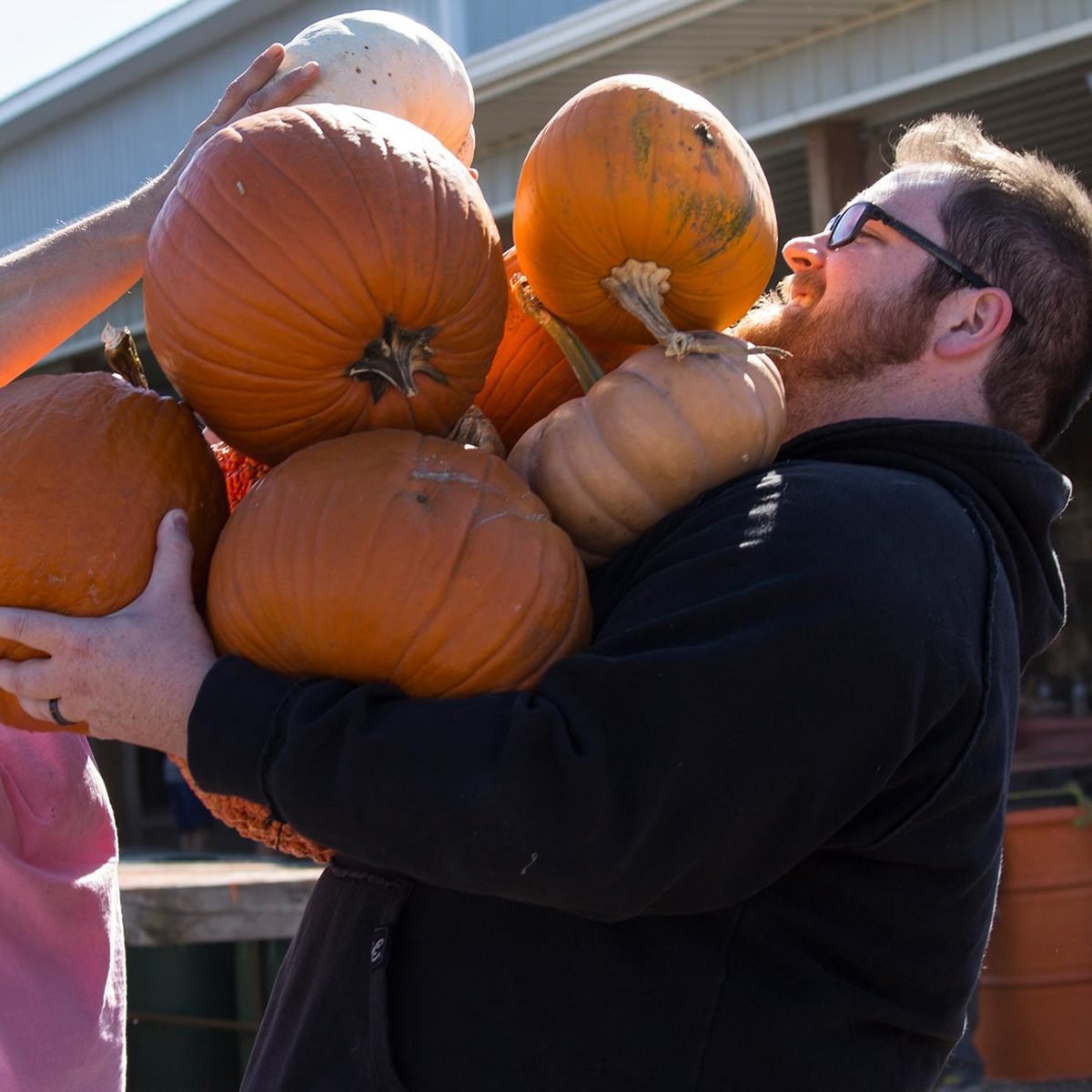 Man carrying pumpkins