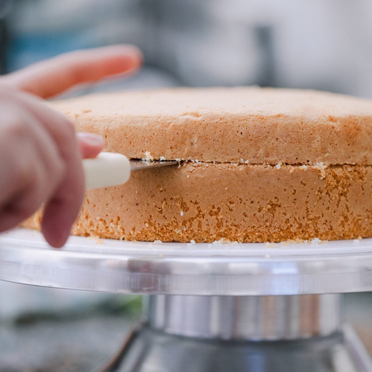 Confectioner cutting the cake to prepare; Shutterstock ID 624975419; Job (TFH, TOH, RD, BNB, CWM, CM): Taste of Home
