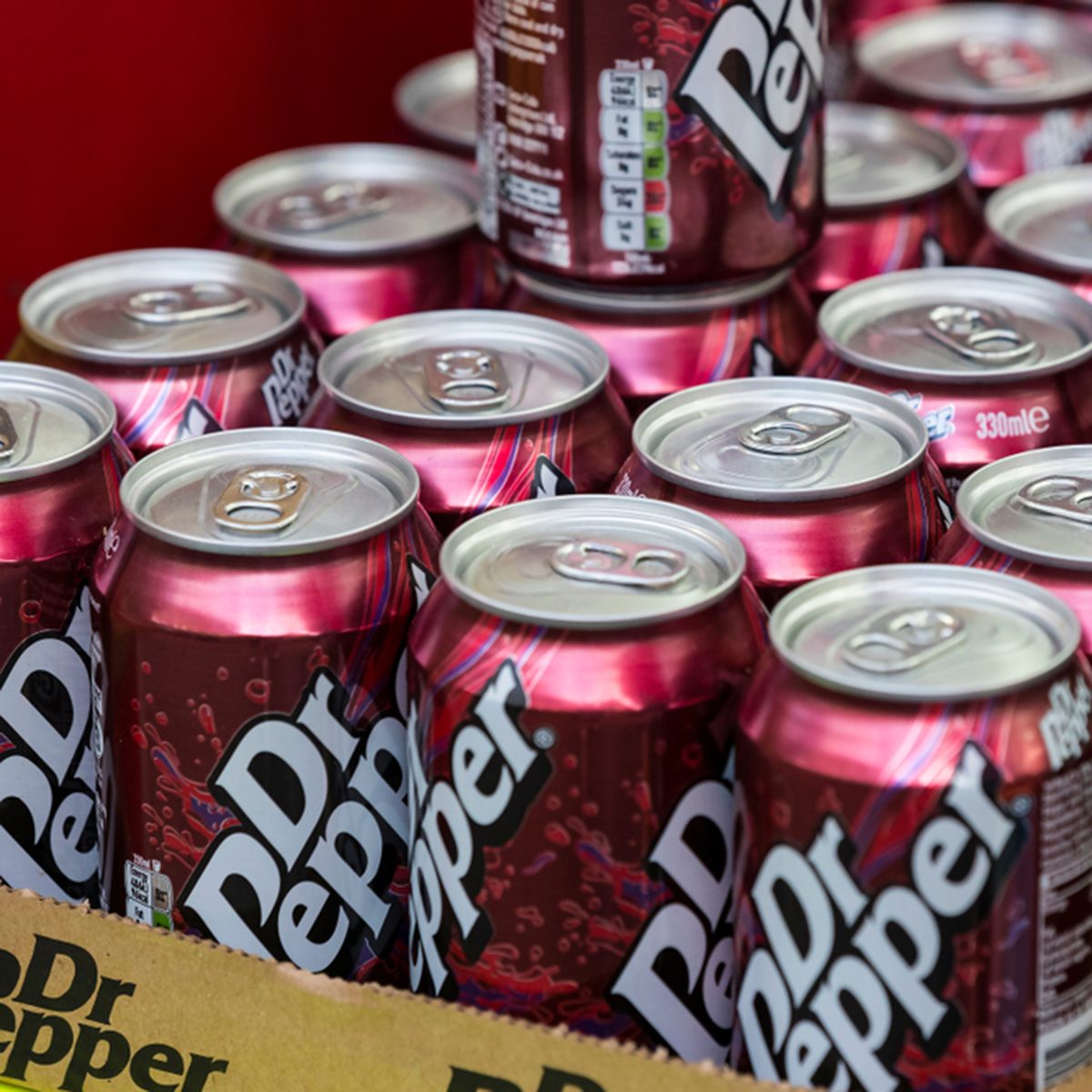 Background with tin cans of Dr Pepper drink attractions of the city Market Sarona.