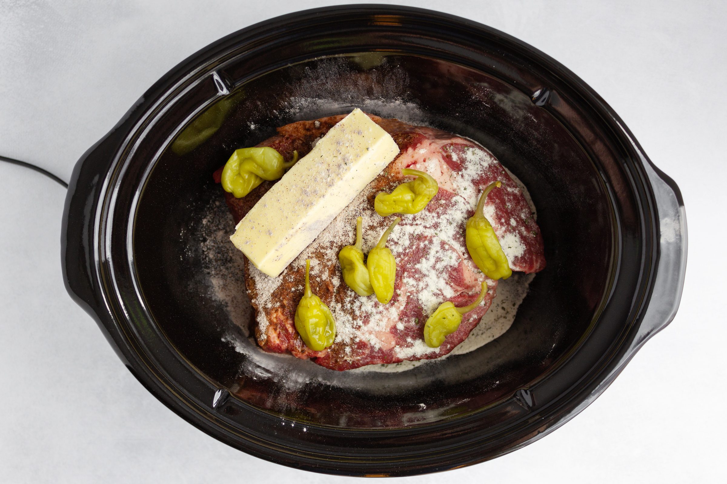 Mississippi Pot Roast slow cooker with ingredients