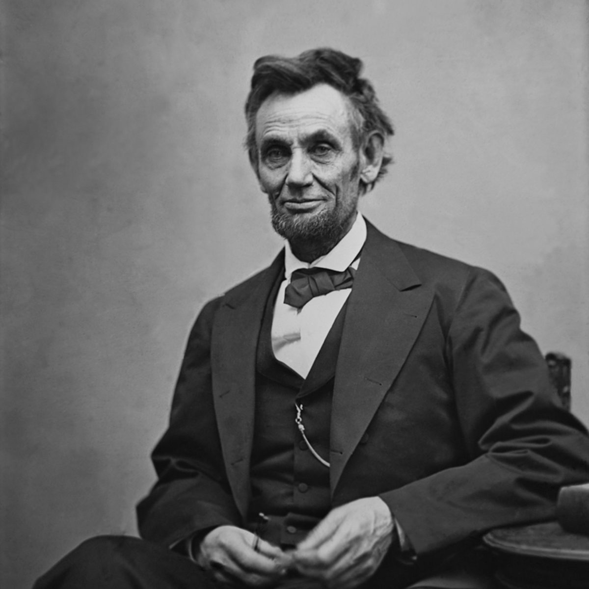 Abraham Lincoln (1809-1865) seated and holding his spectacles and a pencil on Feb. 5, 1865 in portrait by Alexander Gardner.