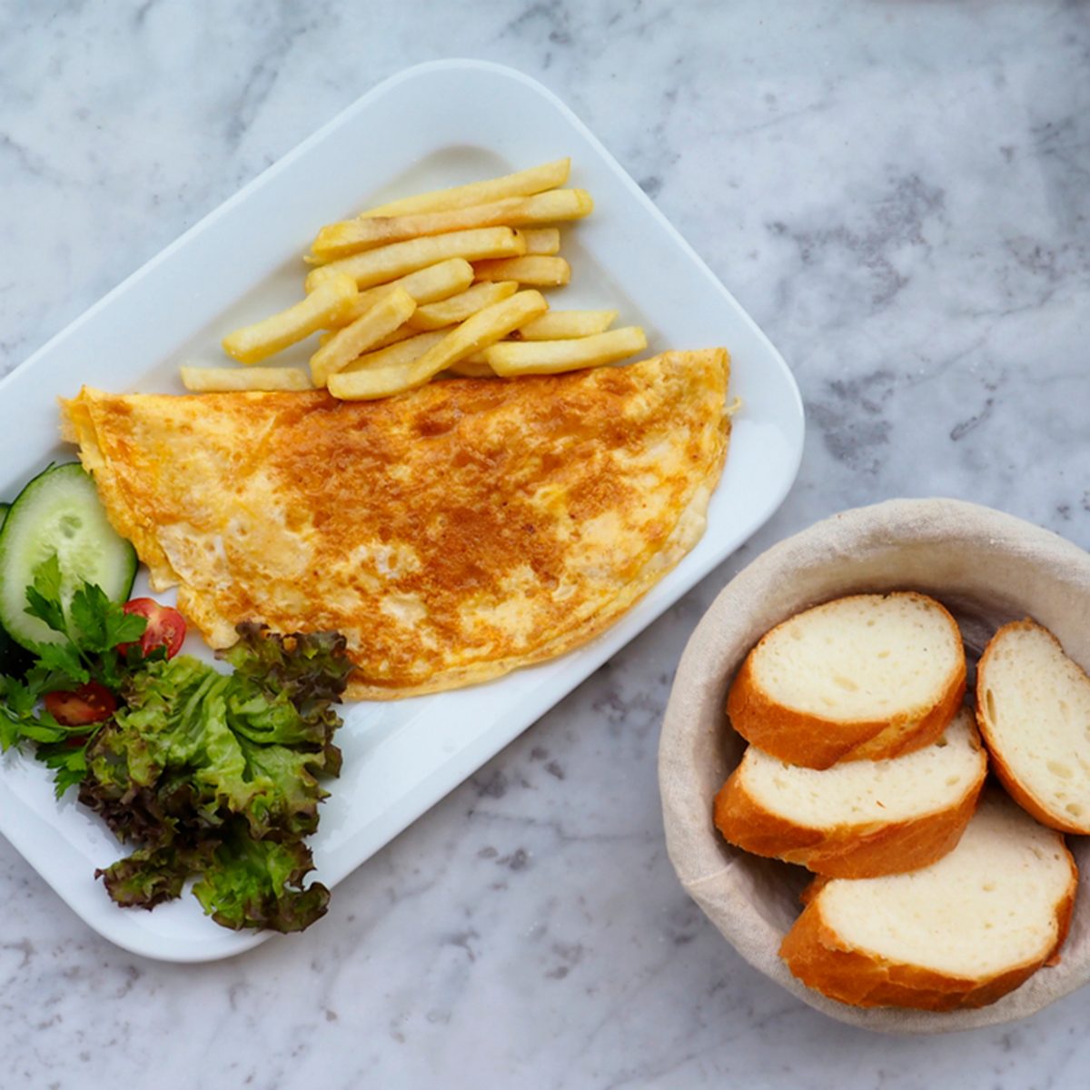 Omelette in a plate on marble background