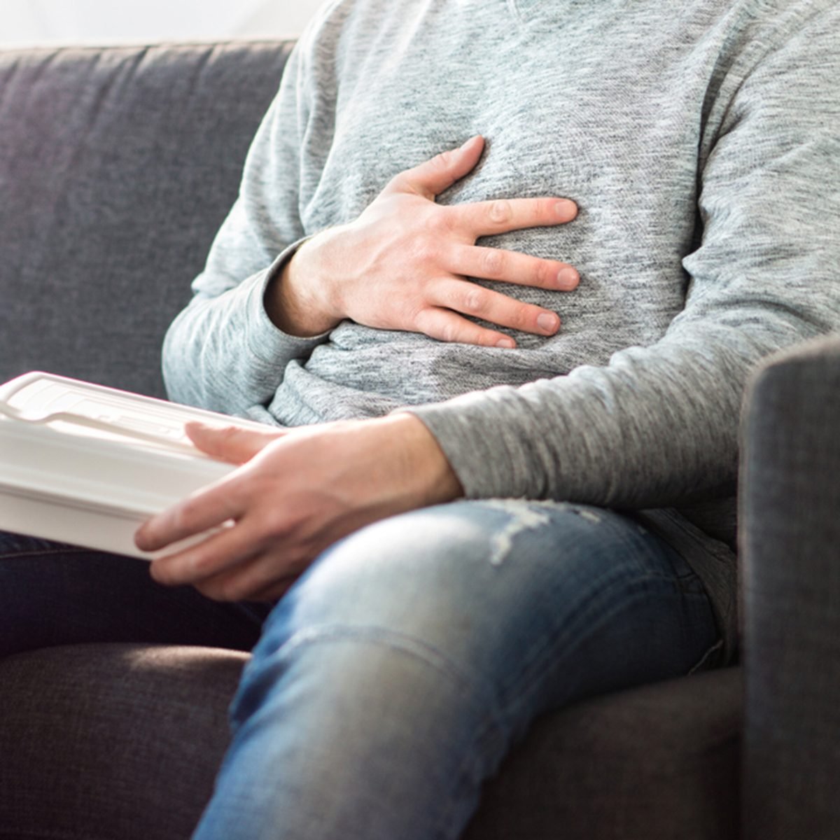 Stomach pain, food poisoning or digestion problem after fast junk food.