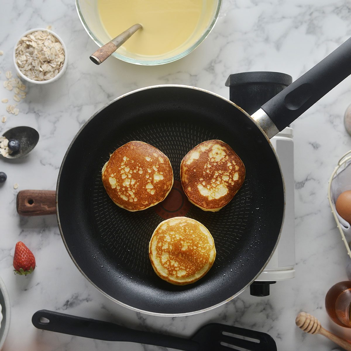 3 pancakes on a pan 