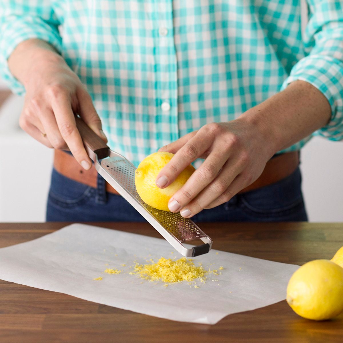 zesting a lemon with a microplane