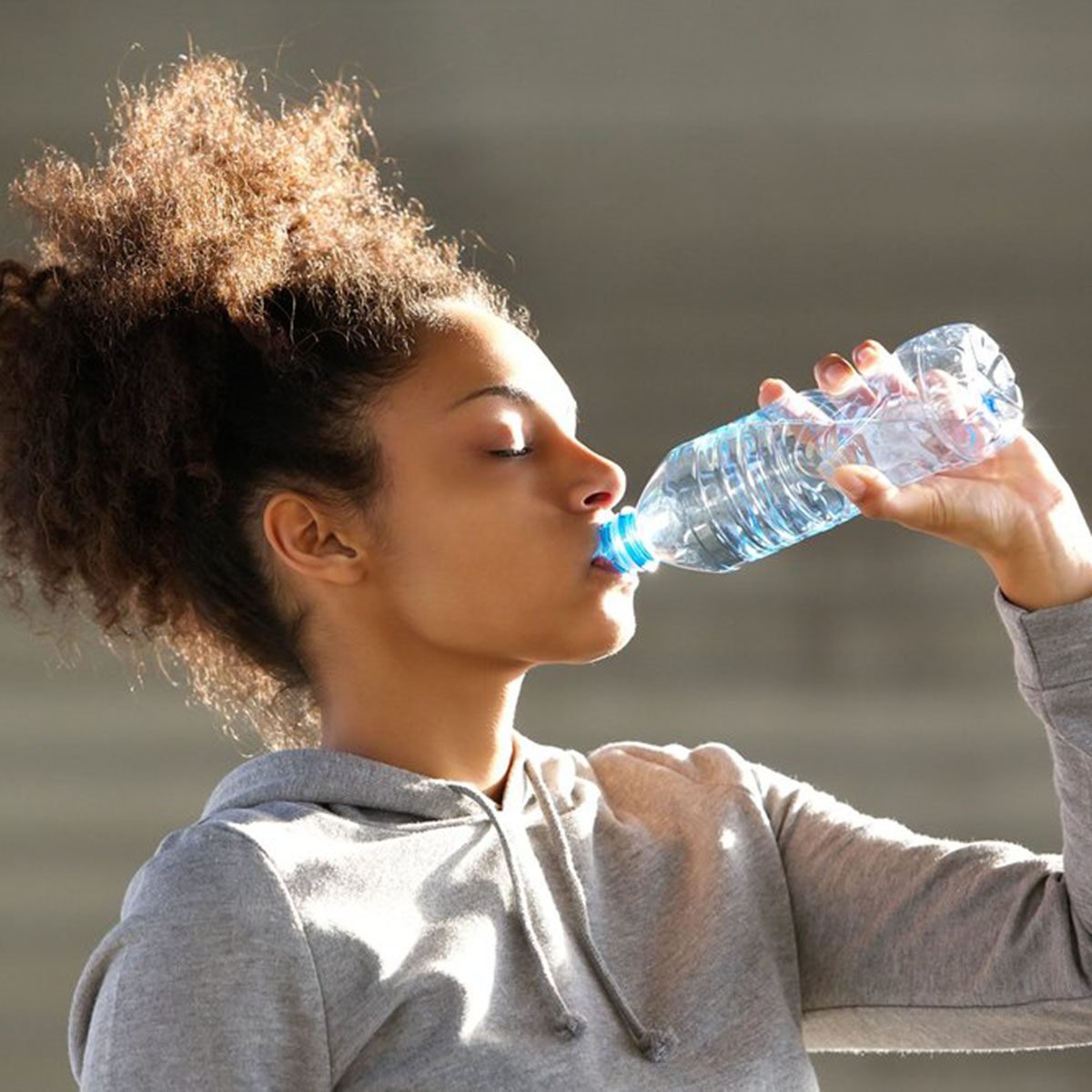 Woman drinking from a water bottle