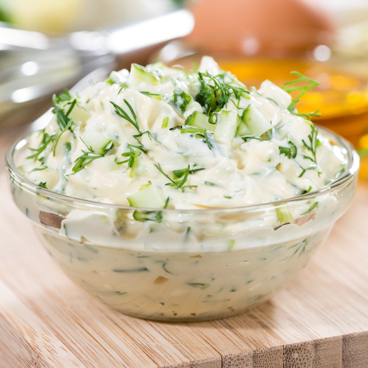 Fresh made Sauce Remoulade (close-up shot) on wooden background