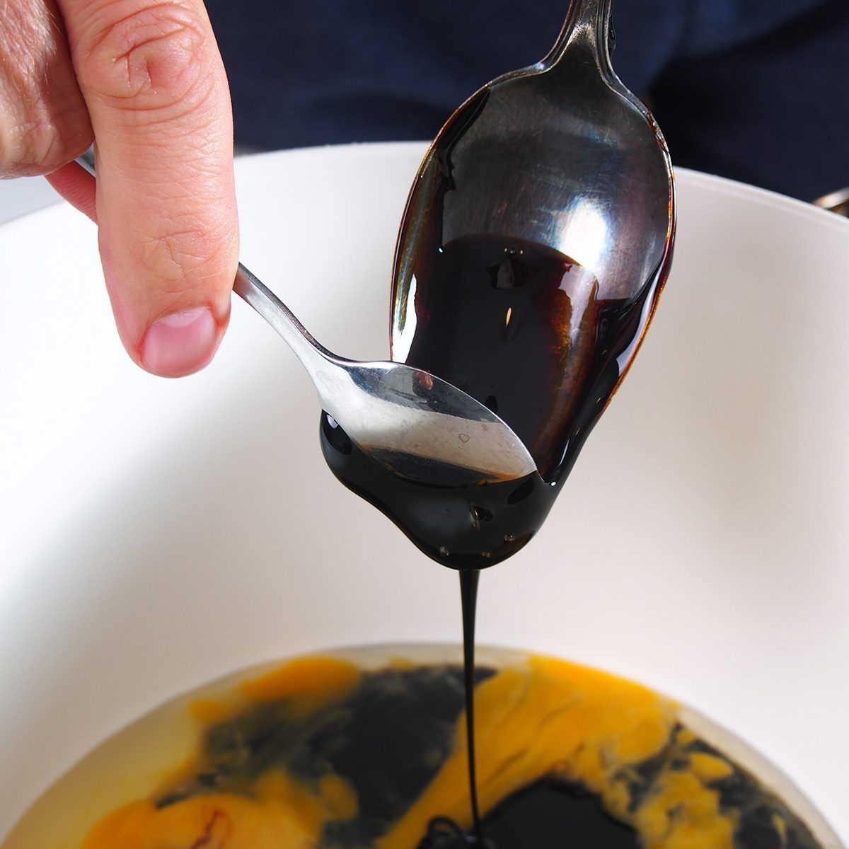 Adding Molasses into Egg Mixture. Making Treacle Pie Series.; Shutterstock ID 1130732765; Job (TFH, TOH, RD, BNB, CWM, CM): TOH