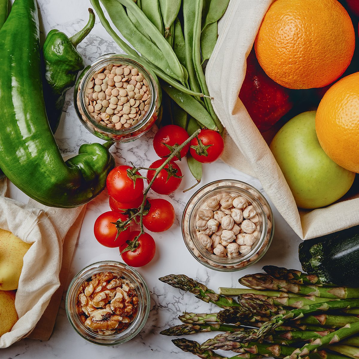 Zero waste grocery shopping. Package-free food on marble background.
