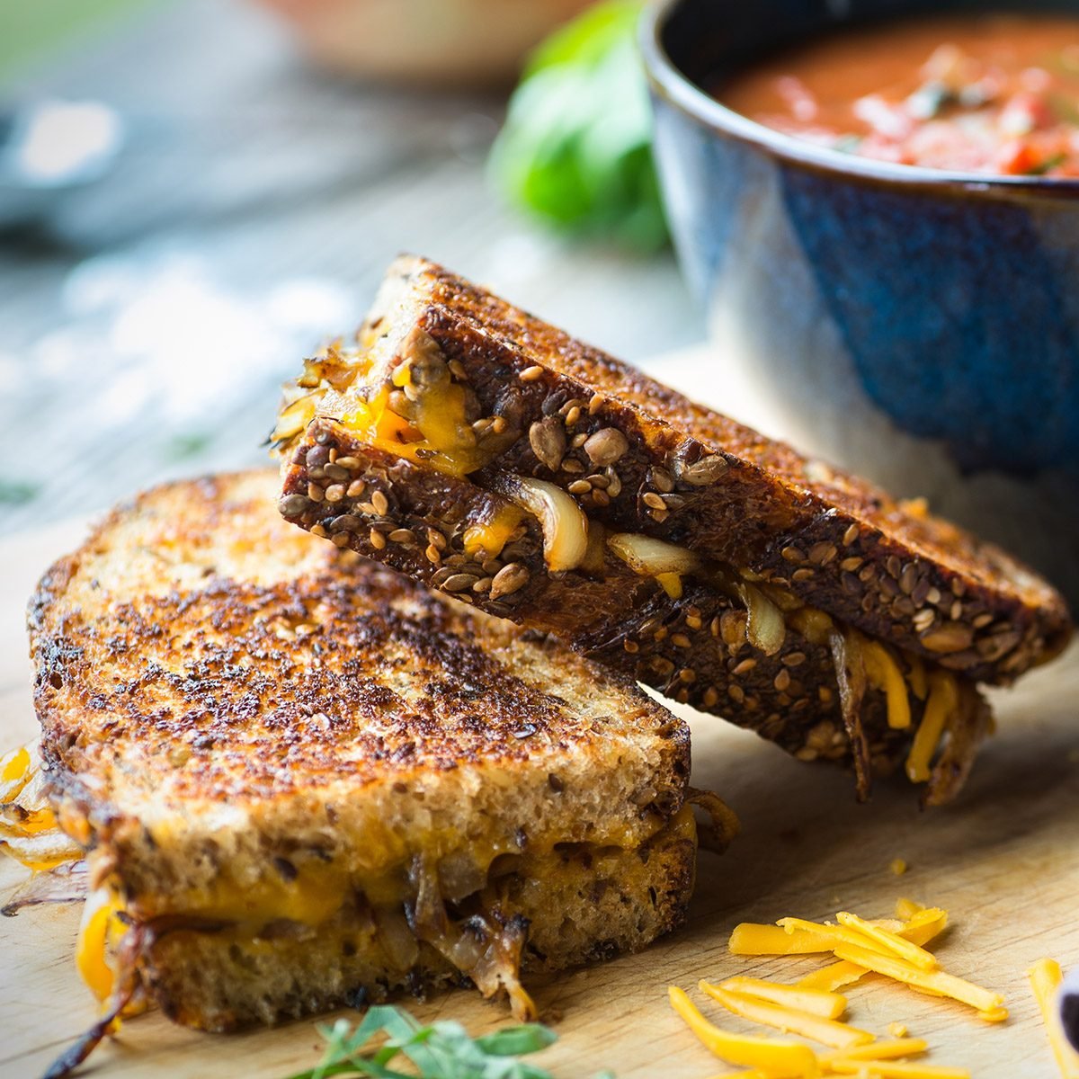 Fresh tomato soup with grilled onion and cheese sandwich